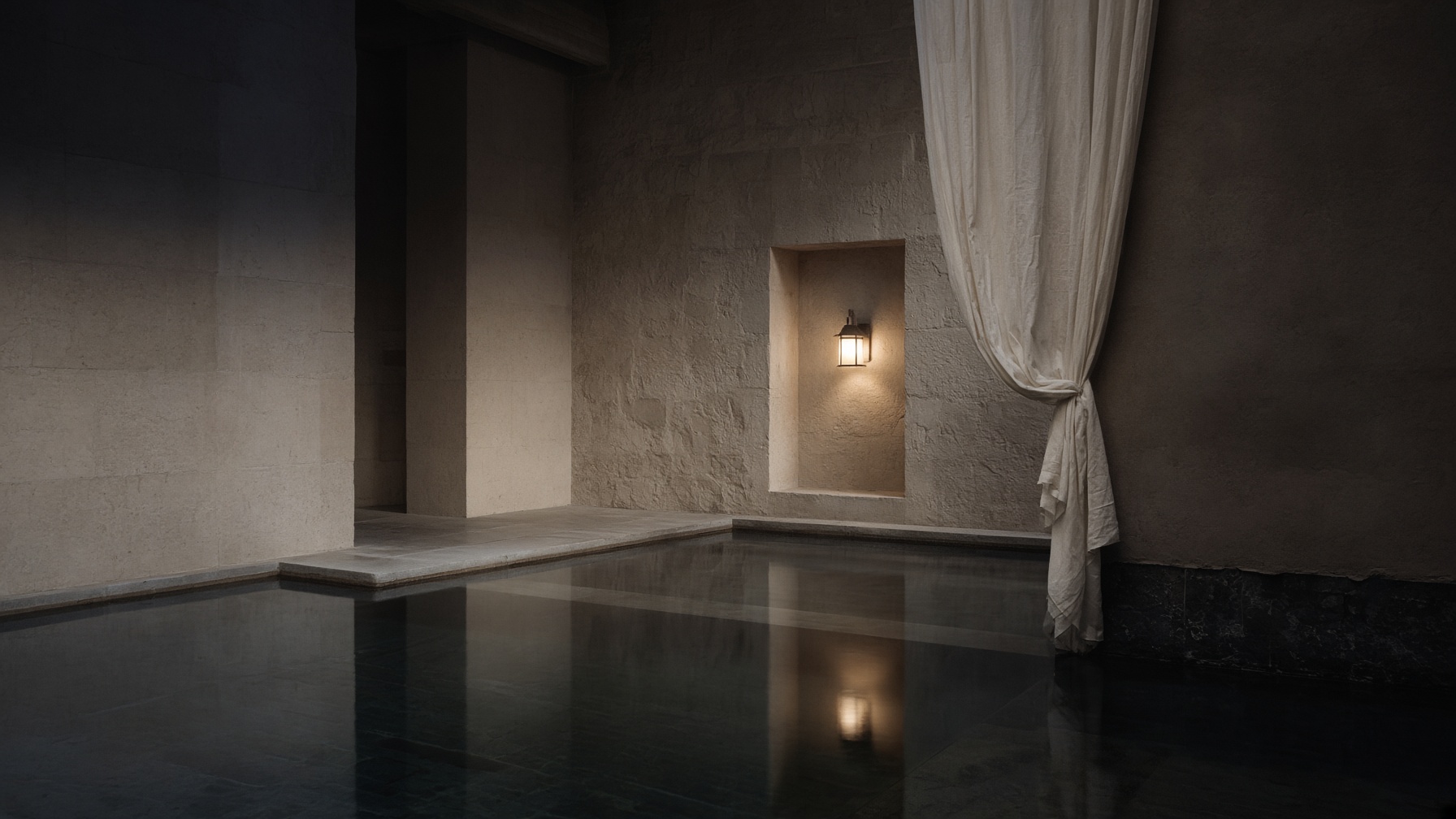 A limestone hotel courtyard at blue hour — still water, one lantern.